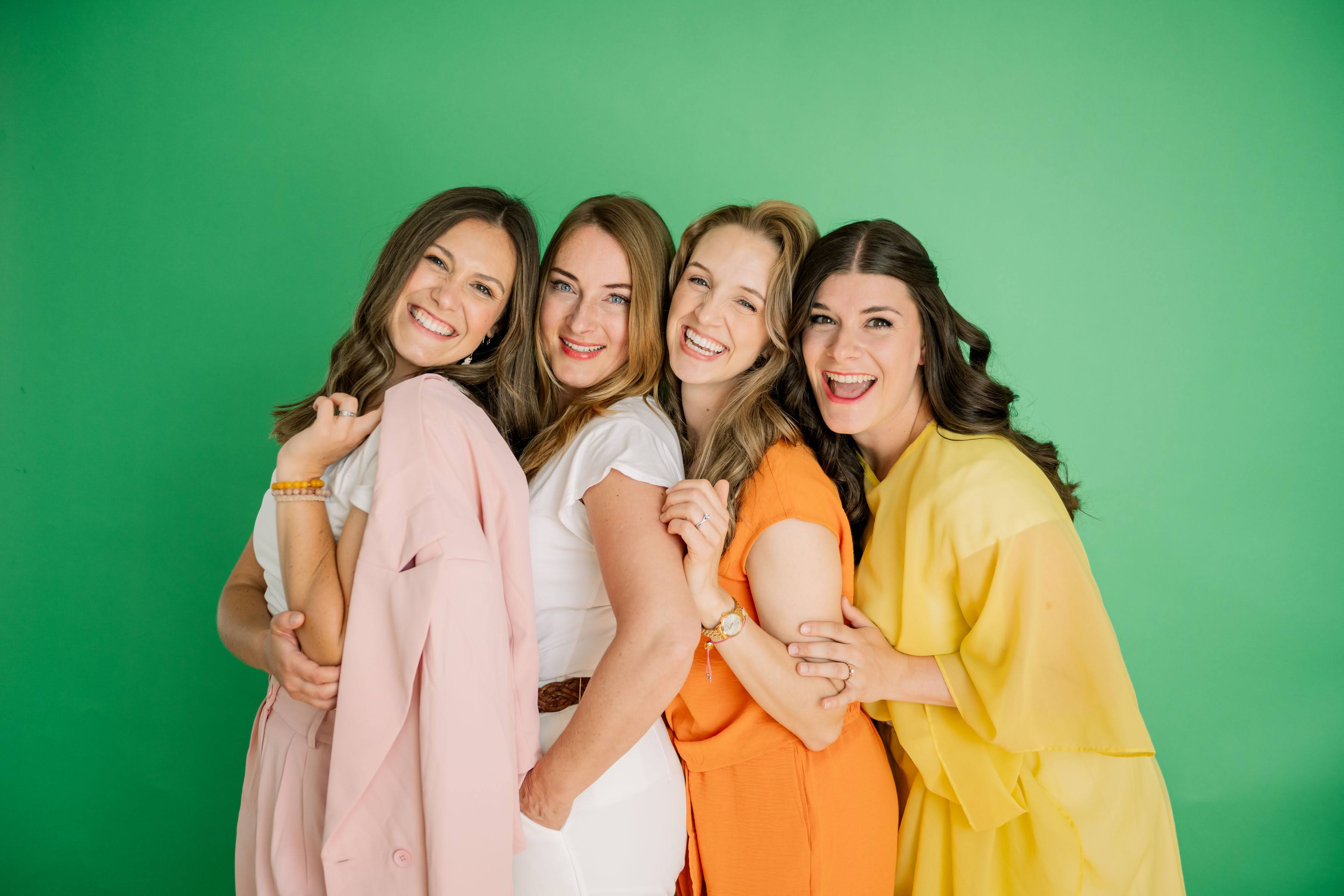 A group of diverse, happy women at a creative conference